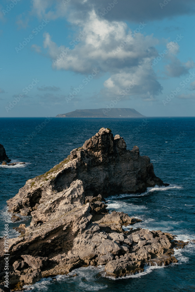 Beautiful rock formation stands in front of the Atlantic Ocean in Guadeloupe island in the Caribbeans.