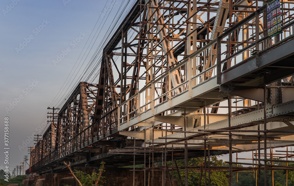 Old railroad tracks on Black Bridge or Lampang Railway Bridge. Railway bridge on river at Lampang thailand. Selective focus.