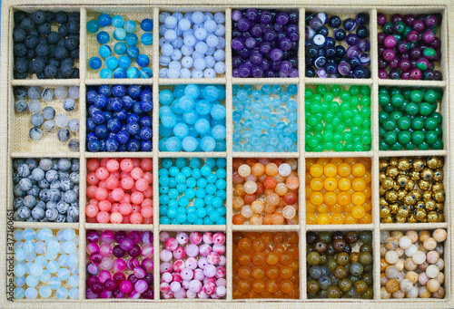 Gem stones. Top view of colorful precious gem stones collection for lady accessories such as necklaces and bracelets.