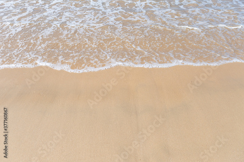 Clean beautiful snad beach with white wave, nature and environmental concept background, summer outdoor day light photo