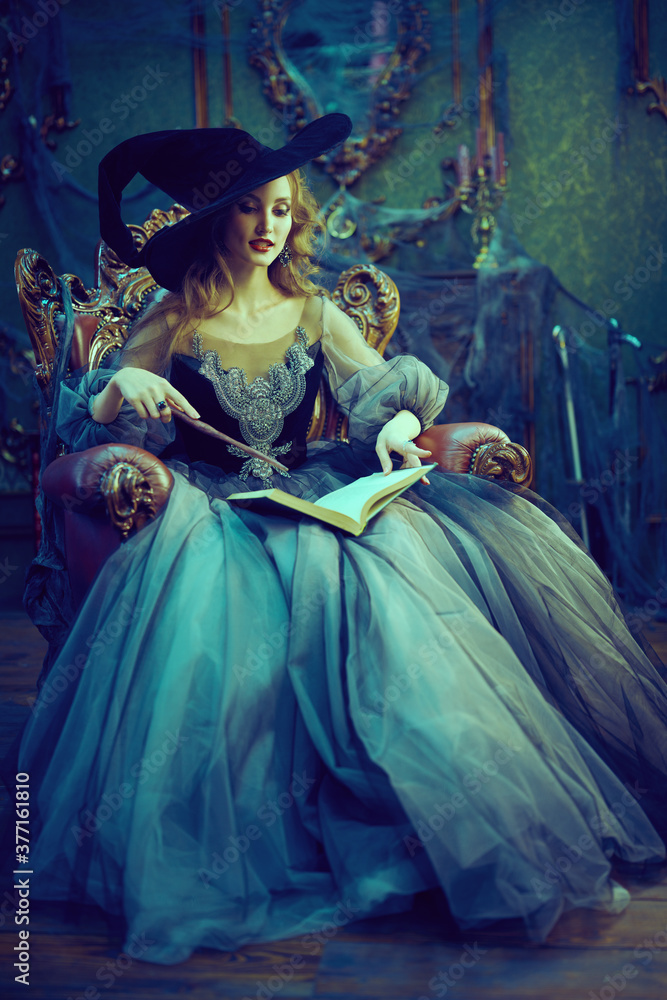 beautiful witch reads spell book