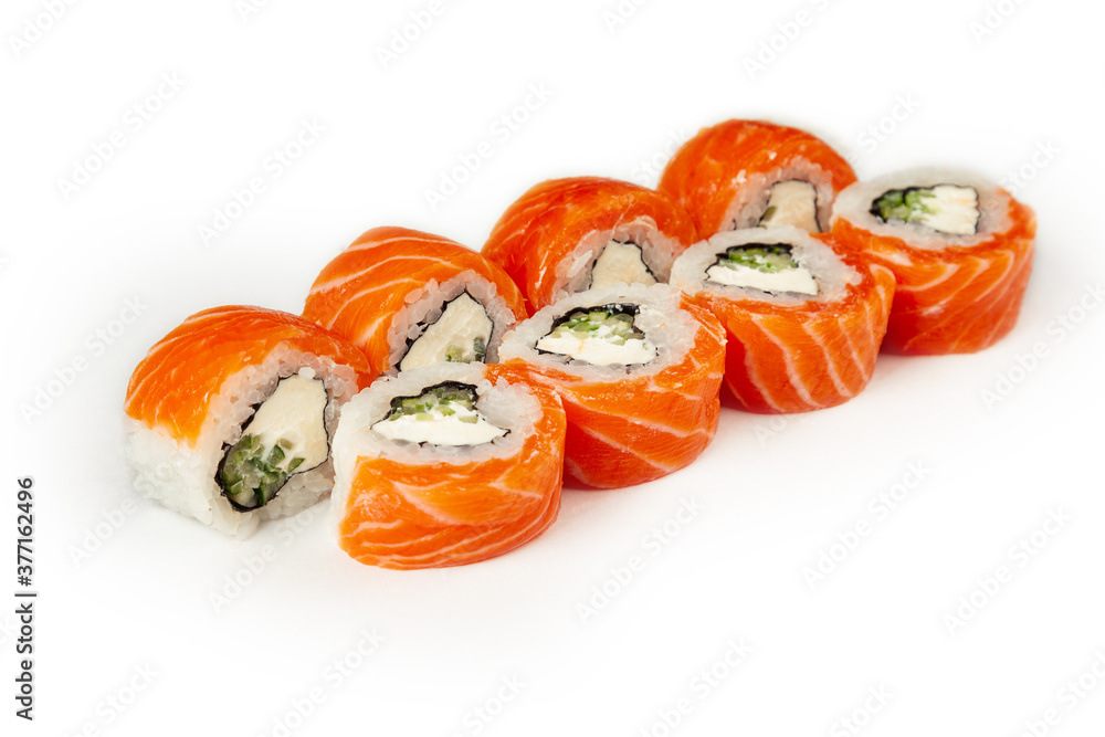 Sushi roll Philadelphia with cucumber on a white plate, classic Japanese sushi. Traditional Japanese food with maki. Delicious pieces of sushi. For the restaurant menu. copyspace Sushi roll Philadelphia with cucumber on a white plate, classic Japanese sushi. Traditional Japanese food with maki. Delicious pieces of sushi. For the restaurant menu. copyspace