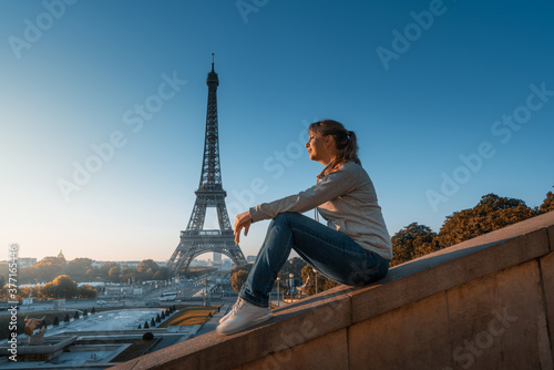 woman and Eiffel tower in sunrise time, Paris, France © Iakov Kalinin