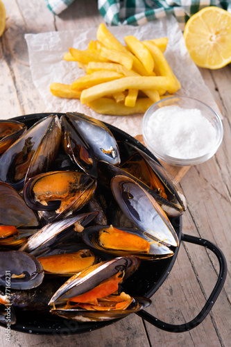 Moussels and french fries or molues-frites. Typical Belgian food. 	 photo