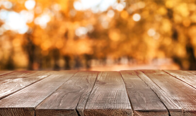 Empty wooden table in beautiful autumn park