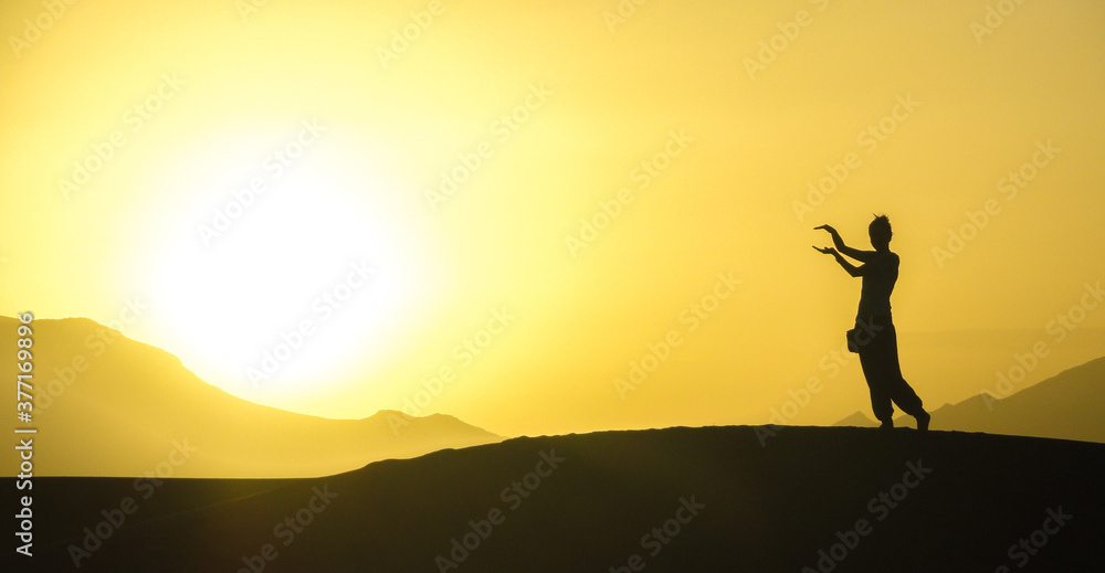 silhouettes sunrise in the desert