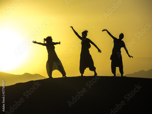 silhouettes sunrise in the desert