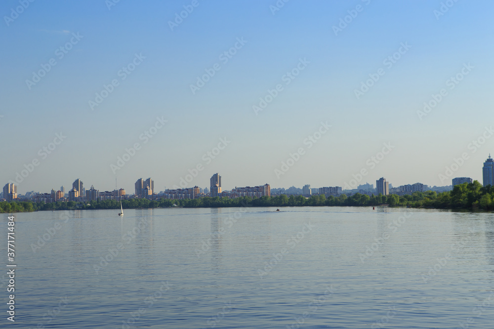 A large body of water next to a large metropolis