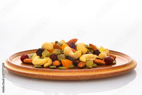 The plate contains nutritious mixed nuts