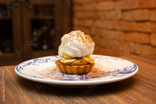 Banoffee Pie. Traditional English dessert prepared with banana and dulce de leche or caramel