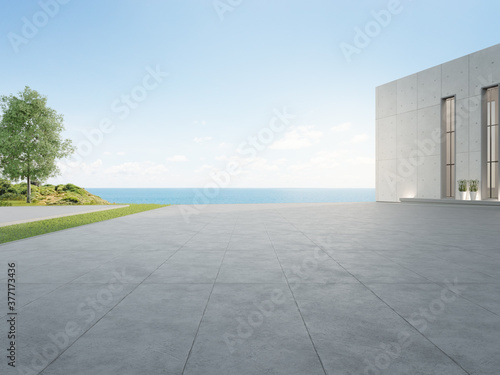 Empty concrete floor and gray wall building. 3d rendering of large beach house with clear sky sea background. photo