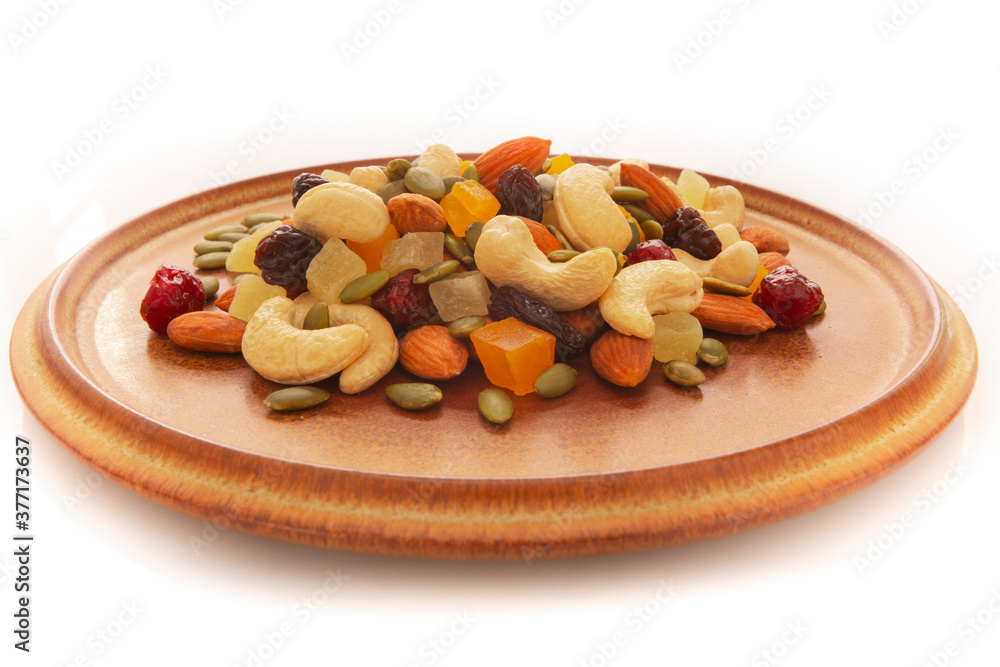 The plate contains nutritious mixed nuts The plate contains nutritious mixed nuts