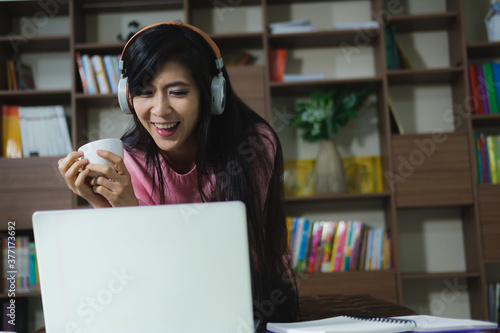 Young beautiful happy women using laptop working from home 