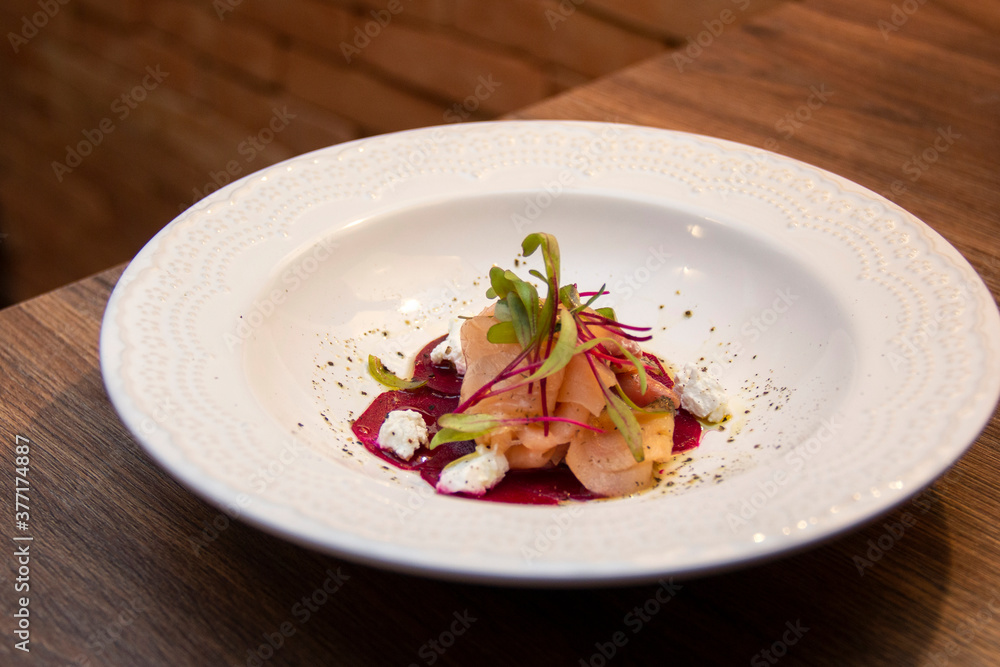Delicious beet carpaccio with gravlax salmon and chévre cheese Delicious beet carpaccio with gravlax salmon and chévre cheese