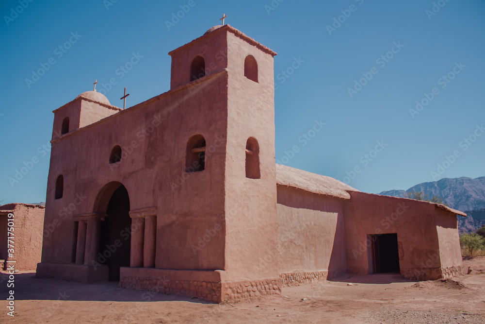 Fototapeta premium Pink Church. Adobe Road, in Catamarca, Argentina