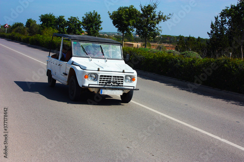 Photos car on the road through the streets of formentera in summer