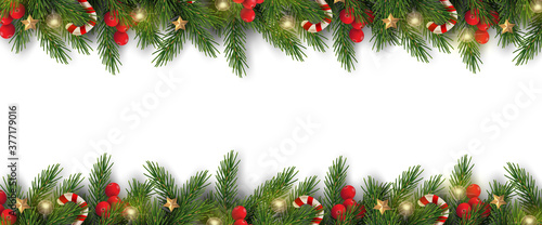 Merry Christmas and Happy New Year. Christmas banner design of tree branches with berries, gold stars, candy canes and decorated in white background. 