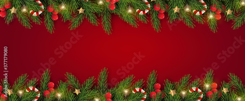 Merry Christmas and Happy New Year. Christmas banner design of tree branches with berries, gold stars, candy canes and decorated in red background. 