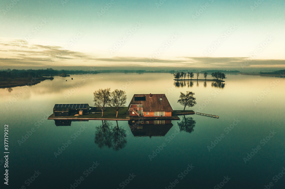 Aerial view of island on lake, Building on the island Aerial view of island on lake, Building on the island