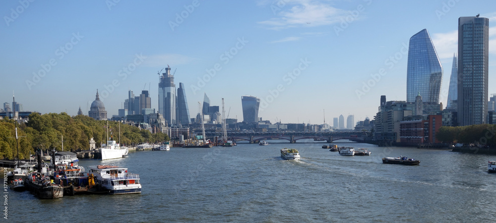 The river Thames and several landmarks on a beautiful summer day in London