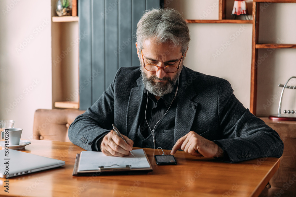 Senior businessman having a video call Senior businessman having a video call