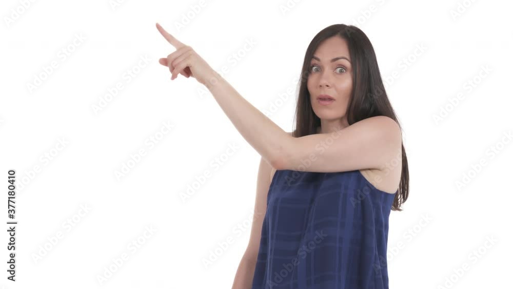 Caucasian woman pointing to the left side in a great amazement. Expression of sincere emotions. Isolated on white background Caucasian woman pointing to the left side in a great amazement. Expression of sincere emotions. Isolated on white background
