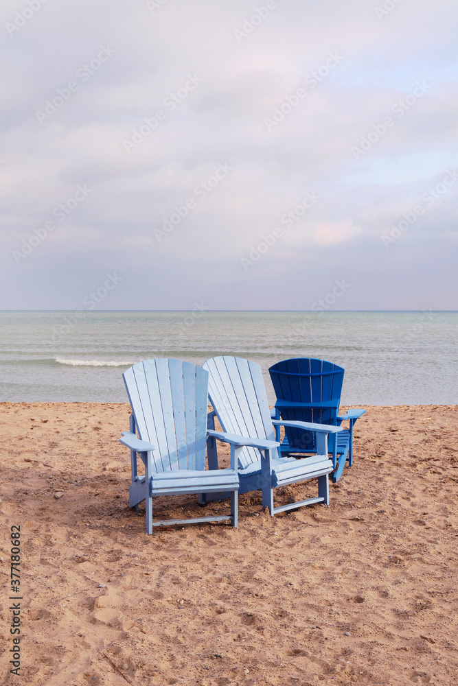 Blue Adirondack Chairs on Beach