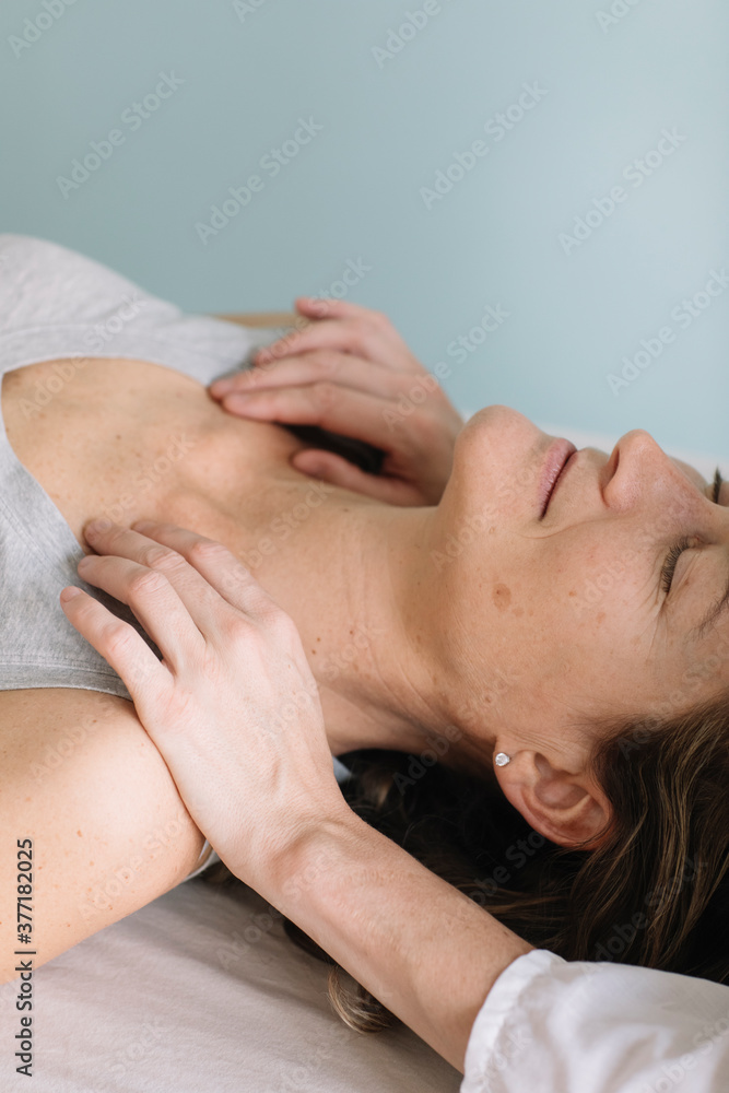 Professional Osteopath Working With Relaxed Caucasian Woman Professional Osteopath Working With Relaxed Caucasian Woman