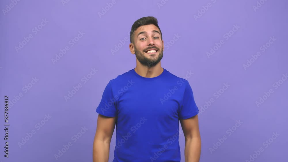 Young caucasian handsome man inviting to come, confident and smiling doing a gesture with hand, being positive and friendly Young caucasian handsome man inviting to come, confident and smiling doing a gesture with hand, being positive and friendly