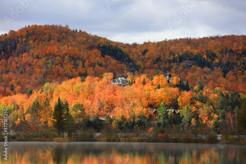 Vacation homes at Mont Tremblant village in Canada surrounded with fall foliage 