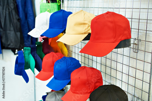 Colored baseball caps on store display