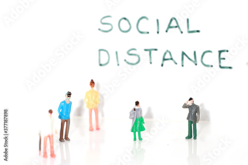 People figures placed at distance to show concept of social distancing  