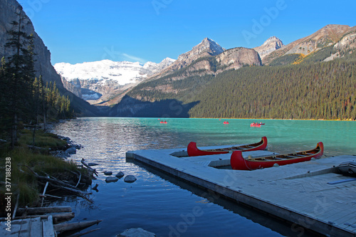 Red Canoes for recreation at Moraine lake in Alberta  Canada 