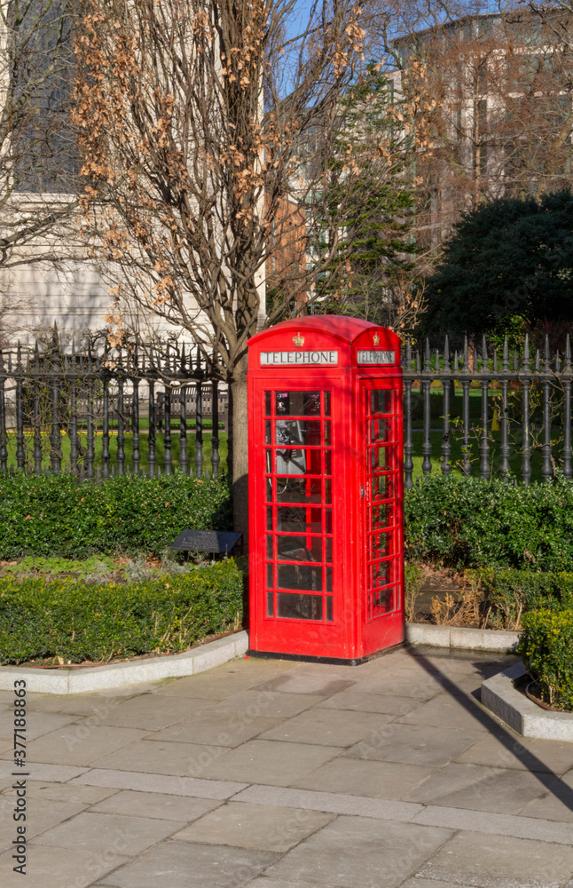 A traditional red phone booth in London. A traditional red phone booth in London.