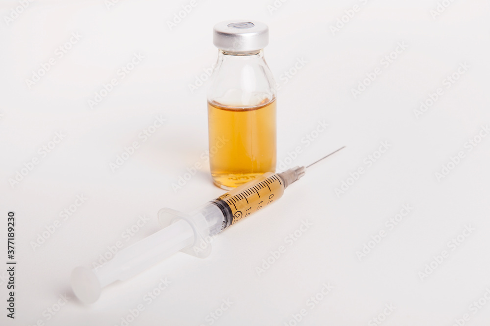 Syringe and medicine bottle on white background. Syringe and medicine bottle on white background.