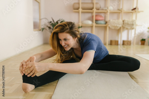 Woman practice yoga in a yoga studio photo