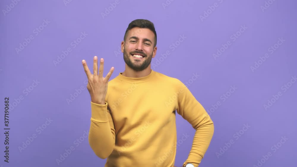 Young caucasian handsome man showing number four, symbol of counting, concept of mathematics, confident and cheerful Young caucasian handsome man showing number four, symbol of counting, concept of mathematics, confident and cheerful