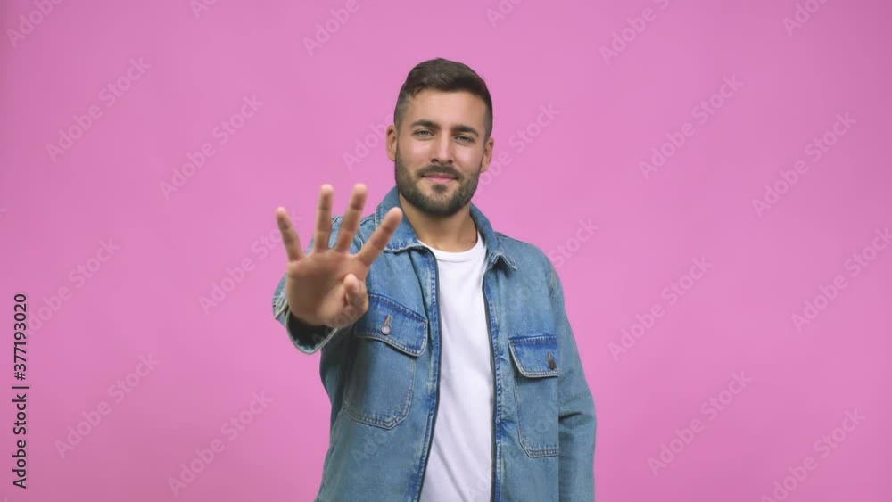 Young caucasian handsome man showing number four, symbol of counting, concept of mathematics, confident and cheerful Young caucasian handsome man showing number four, symbol of counting, concept of mathematics, confident and cheerful