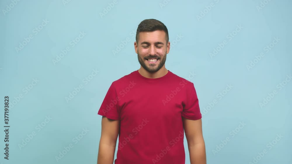 Young caucasian handsome man cheerful and smiling pointing to the front with both hands Young caucasian handsome man cheerful and smiling pointing to the front with both hands