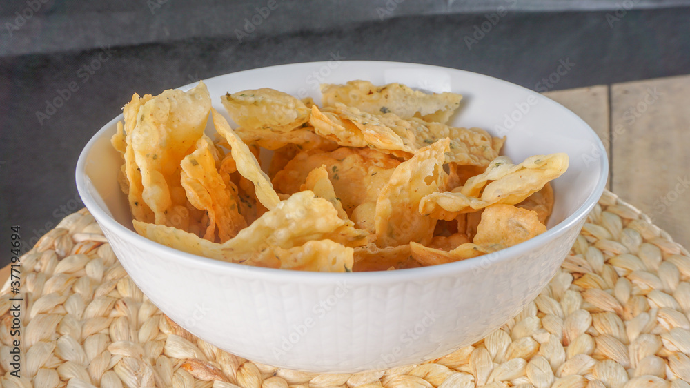 Crispy salty snacks on wooden background. close up shot Crispy salty snacks on wooden background. close up shot