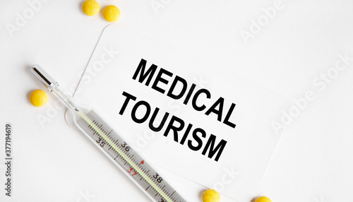 On the card is the inscription MEDICAL TOURISM, next to the stethoscope.