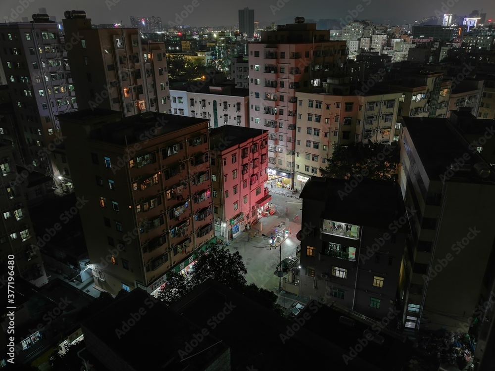 Shenzhen city living complex buildings at night from rooftop