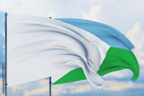 White flag on flagpole waving in the wind and flag of Djibouti. Closeup view  3D illustration.