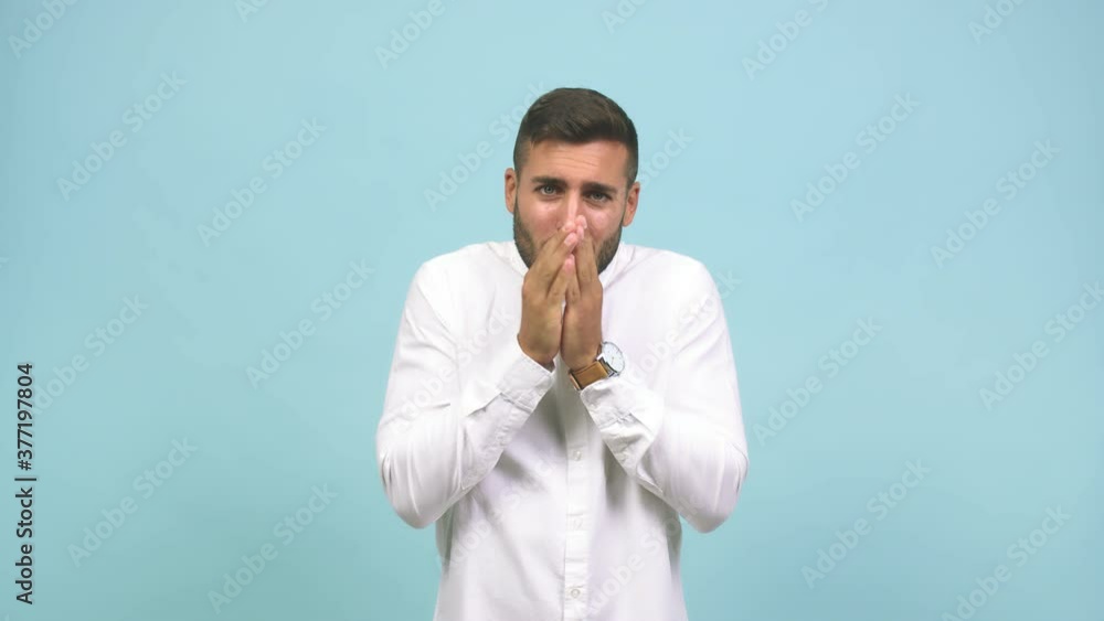 Young caucasian handsome man going cold, shivering and tired, probably due to a virus Young caucasian handsome man going cold, shivering and tired, probably due to a virus