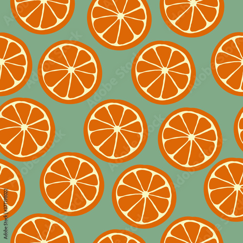 Simple orange pattern. Orange circles on an green background. The print is suitable for Wallpaper.