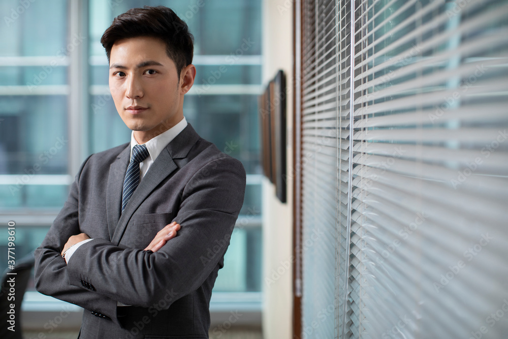 Confident businessman in office Confident businessman in office