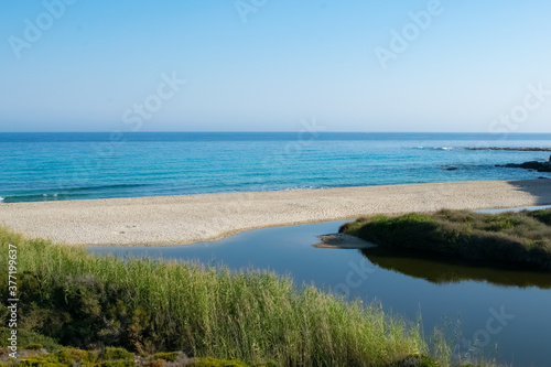 Aerial image of beaches in Ikaria with nature surrounding in Septemberwith with lake
