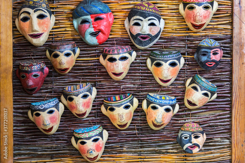 Handmade masks on the wall in Uzbekistan
