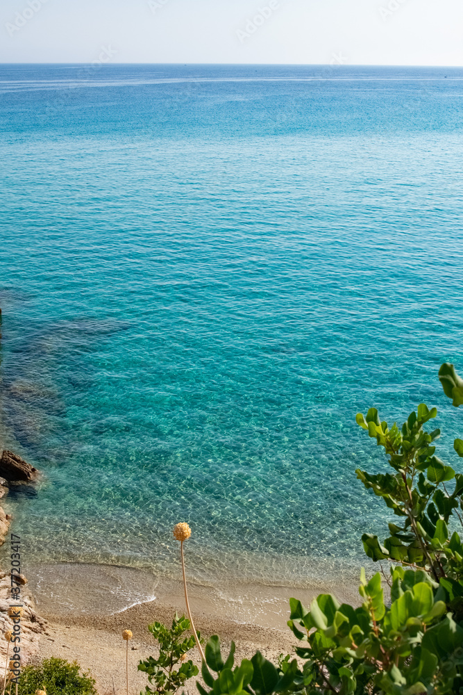 Fototapeta premium Aegean sea beach colors with transparent blue water in Ikaria