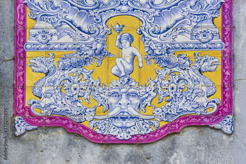 panels of polychrome azulejos on the walls of a beautiful ruined house in Setubal